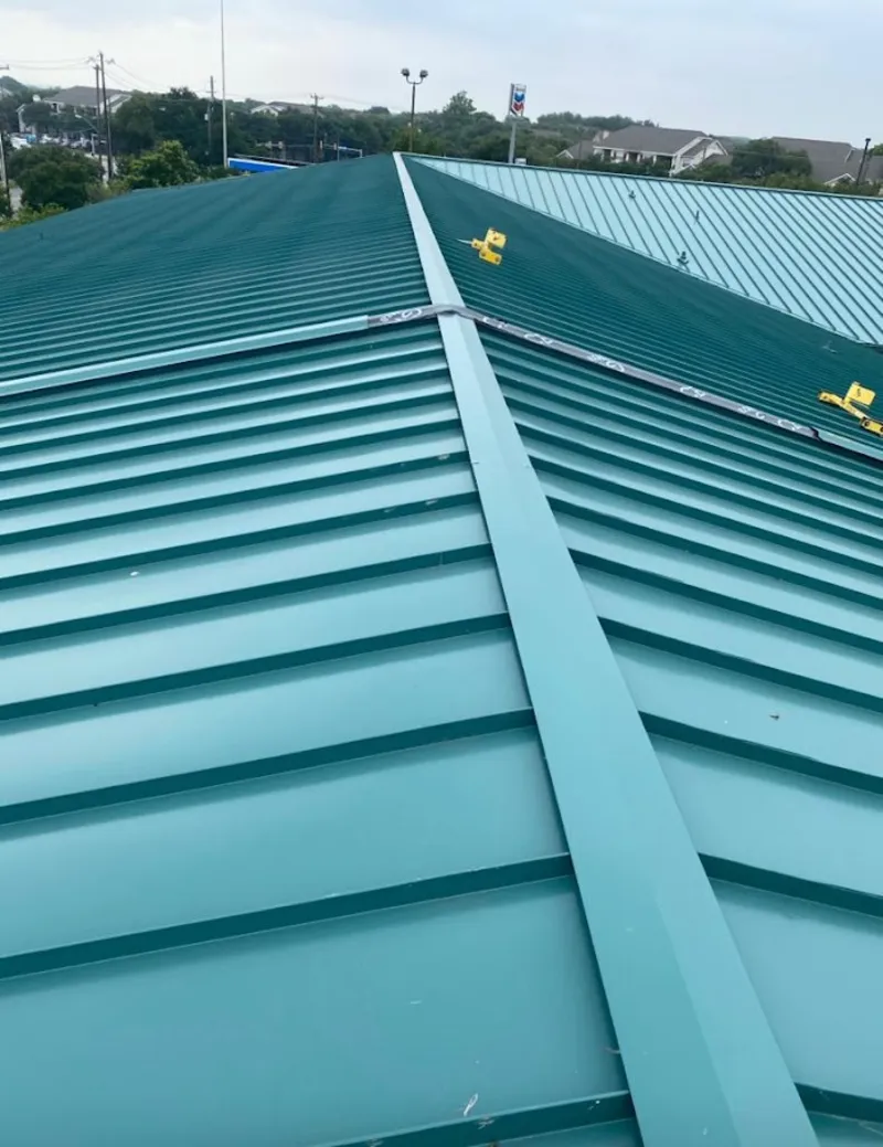 Green commercial metal roof ridge and valley for Metal Roof Repair in Owatonna